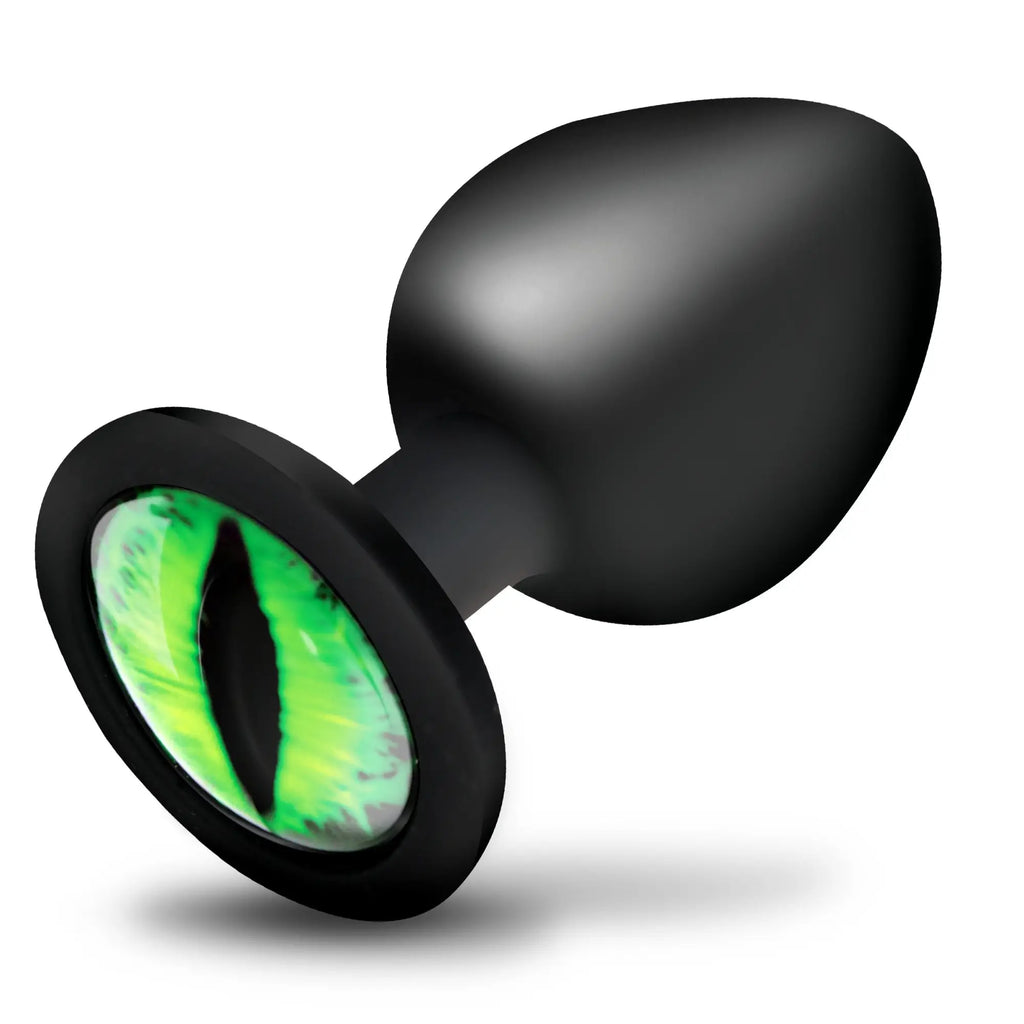 Creature Cocks Creature Eye silicone butt plug, featuring a smooth black teardrop base with a vibrant green cat-eye.