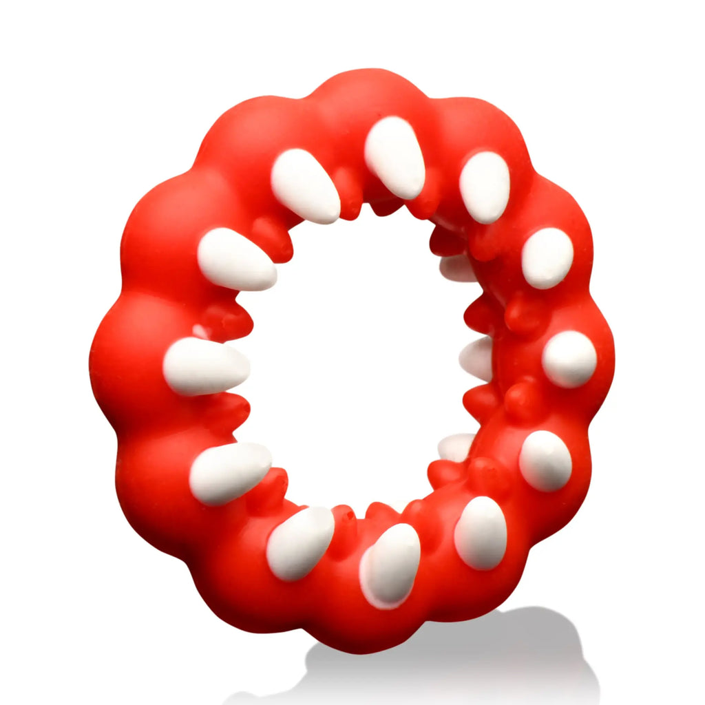 Creature Cocks Fangs silicone cock ring in bright red with white teeth-like accents along the inner ring.