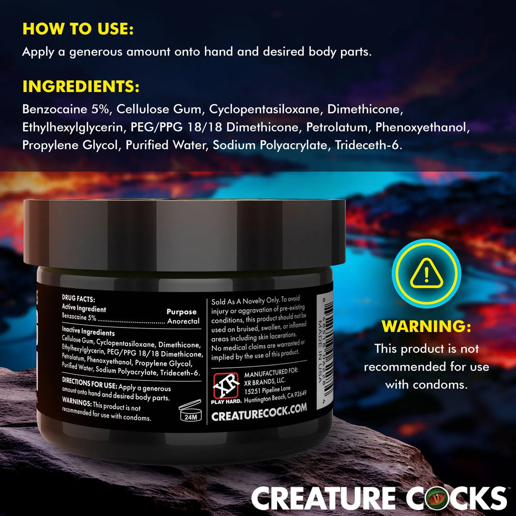 Creature Cocks Fisting Cream jar against a dramatic, dark lava-themed background with visible product label details.