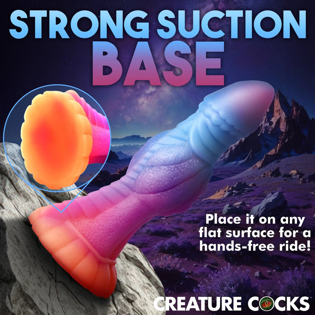 Creature Cocks Galactic Alien glow-in-the-dark silicone dildo with a blue-to-pink gradient and suction cup base.