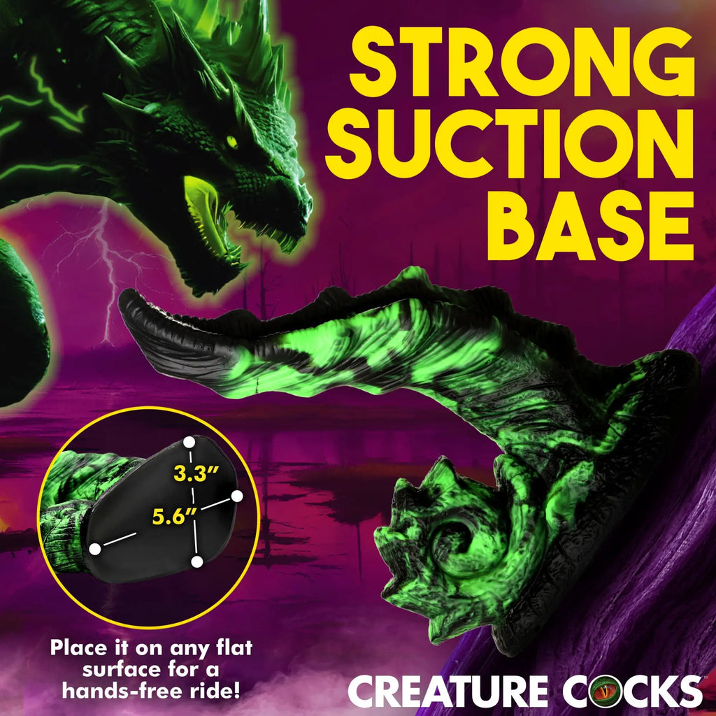 Creature Cocks Glowzilla glow-in-the-dark silicone dildo with textured dragon design and a large black suction base.