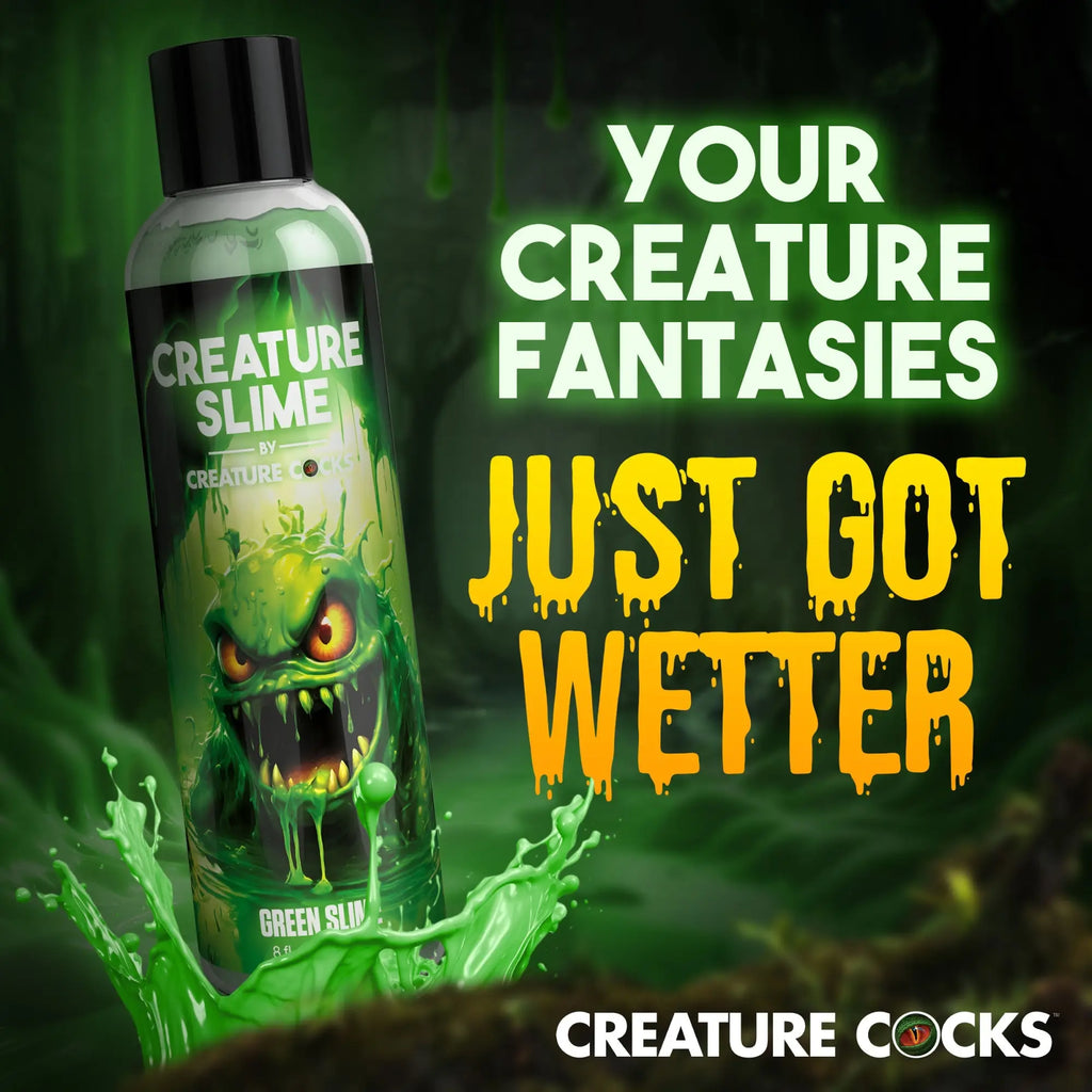 Bottle of Creature Cocks Green Creature Slime lubricant with an angry green monster graphic and green slime splashes.