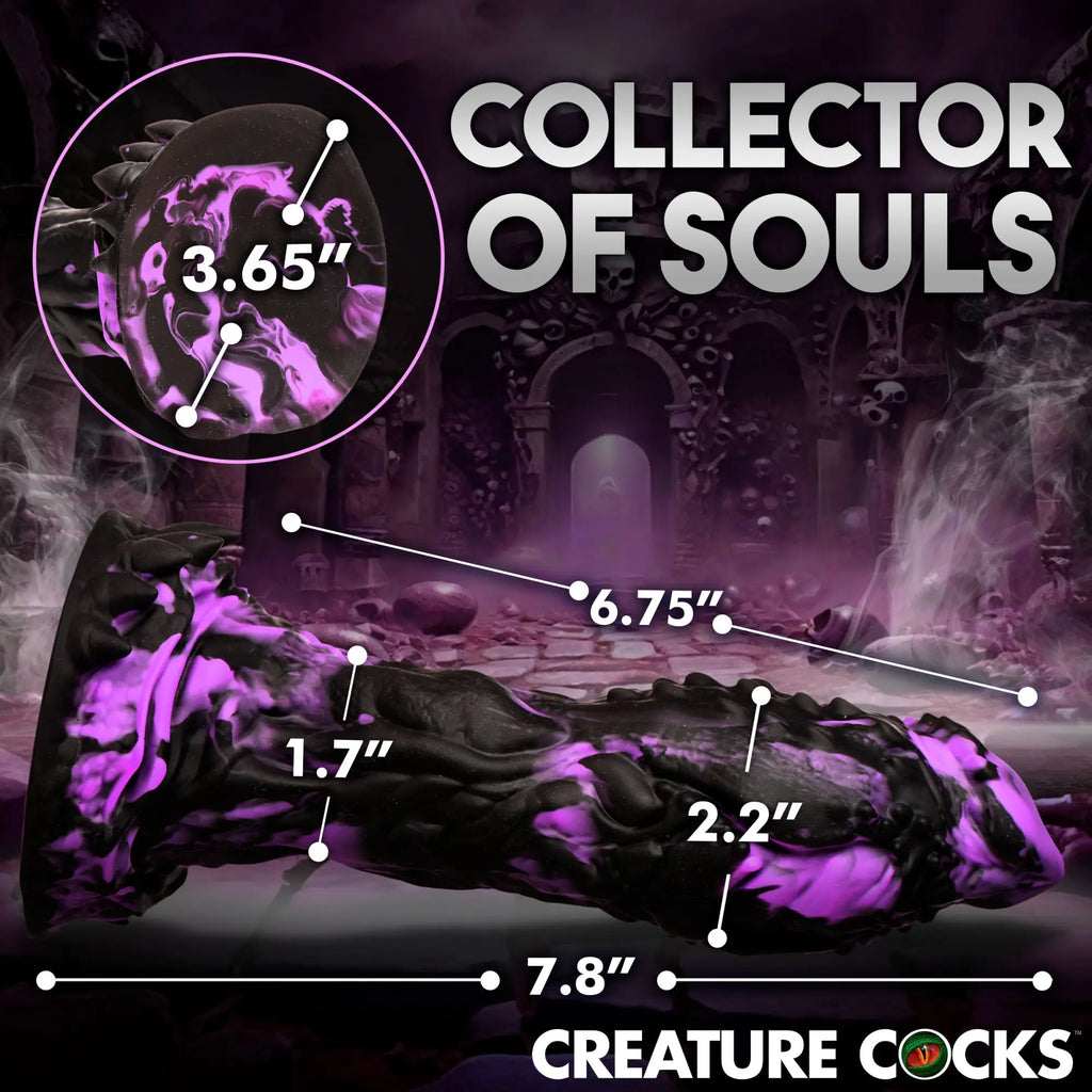 Creature Cocks Grim silicone dildo in black with purple swirls, shown with dimension labels against a dark, misty background.