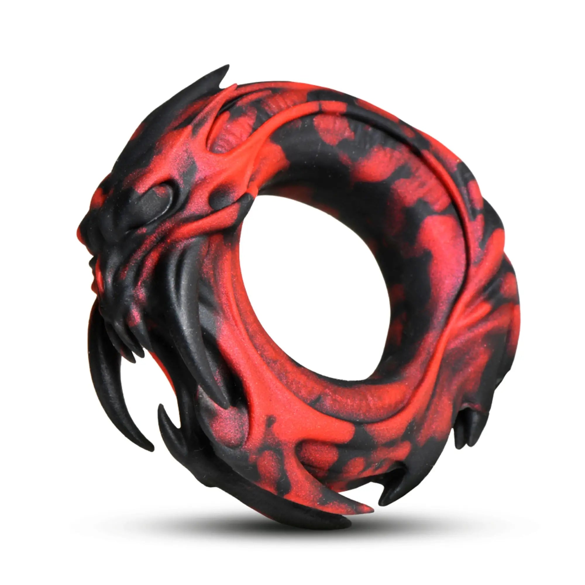 Creature Cocks Hell Fang silicone cock ring in a marbled red and black dragon-inspired design with protruding fangs.