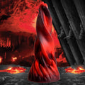 Creature Cocks Hell Kiss Twisted Tongues silicone dildo in marbled red and black, set against a volcanic landscape.