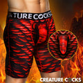 Creature Cocks Horny Devil boxer shorts in red and black scale print with a molded, horn-accented anatomical pouch.