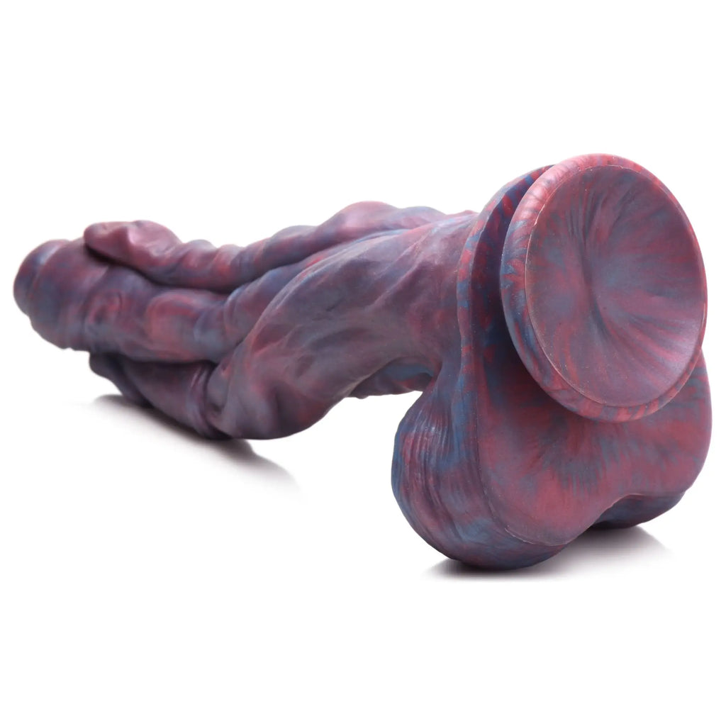 Creature Cocks Hydra silicone dildo in a marbled purple and red finish with a textured, multi-headed monster design.