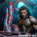 Creature Cocks Hydra X: A blue and red textured vibrating silicone dildo with a remote, set against a fantasy backdrop.