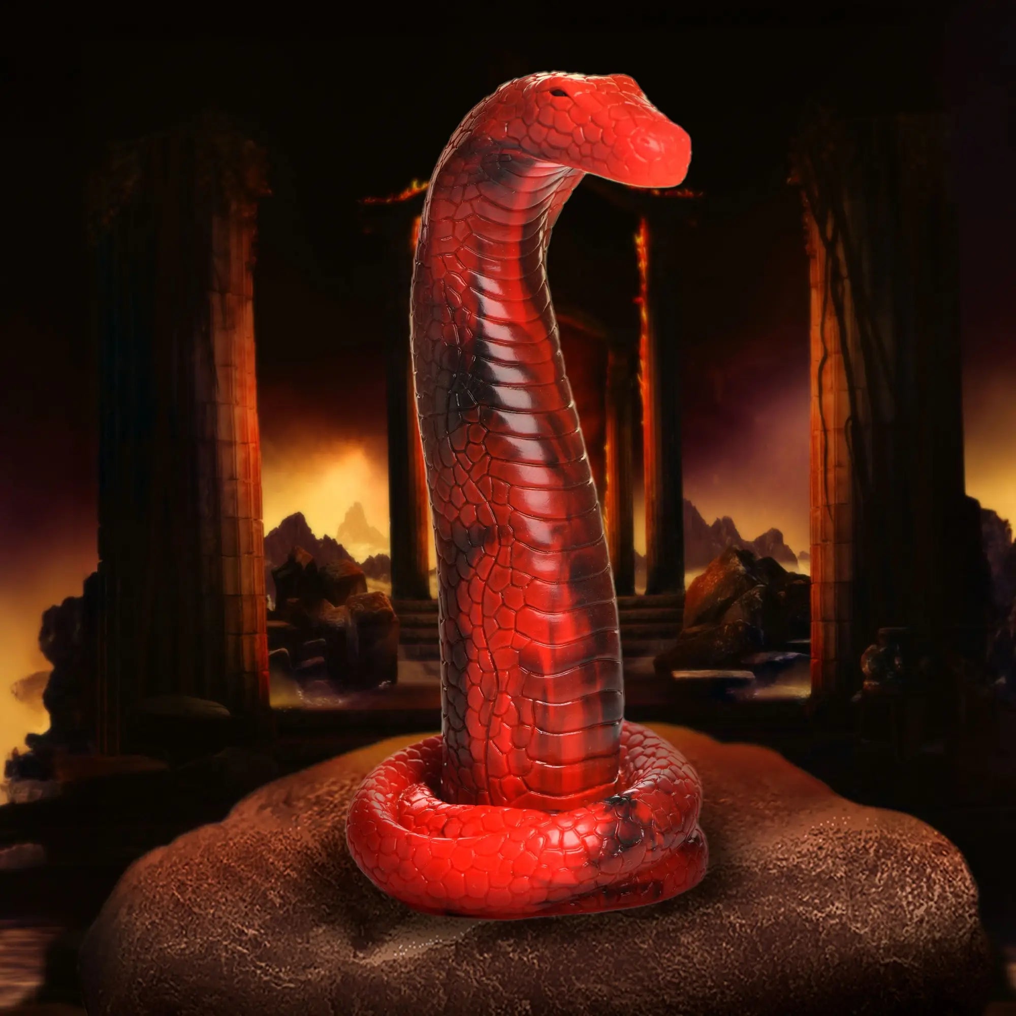Creature Cocks King Cobra silicone dildo in bright red with black marbling, coiled base, and textured scale details.