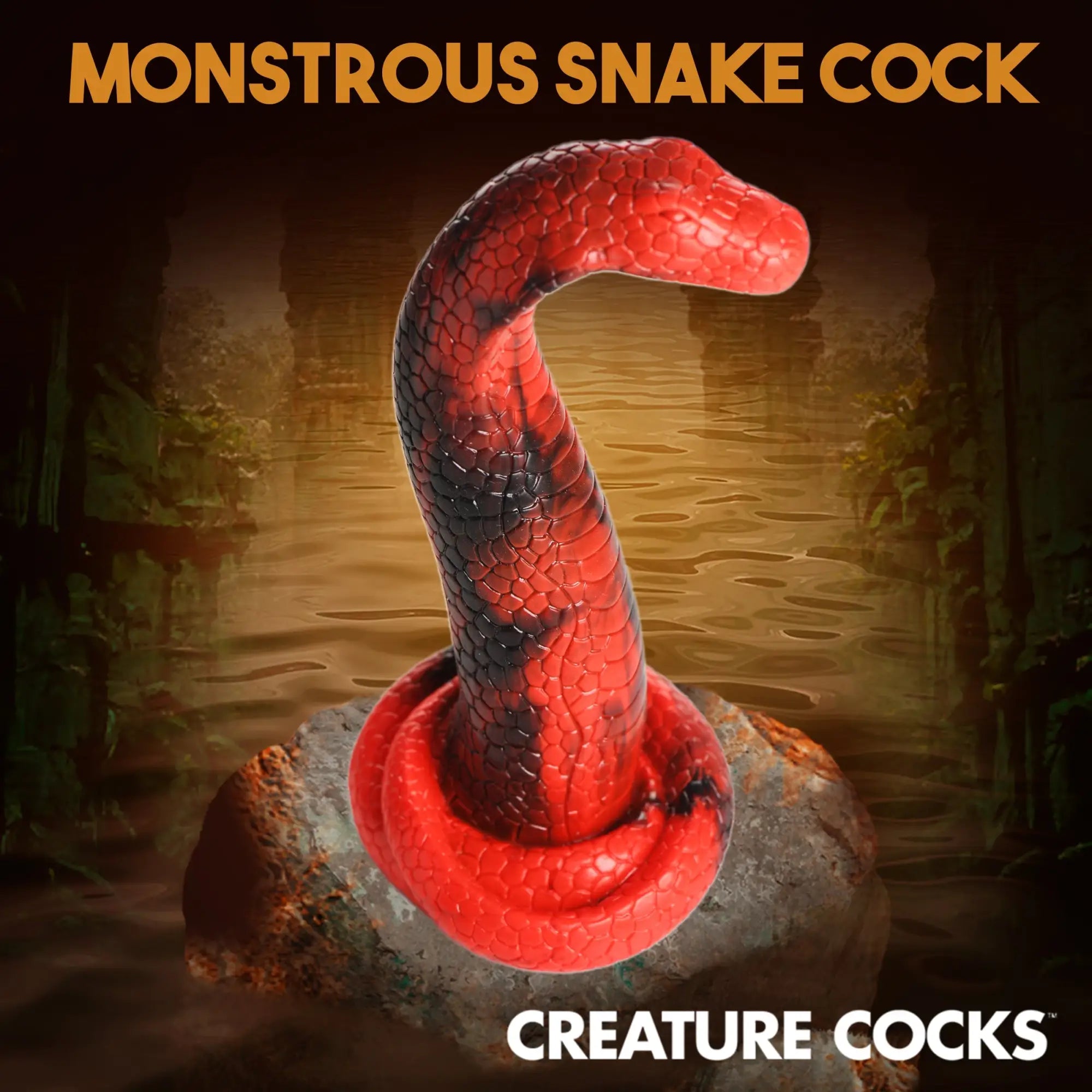 Creature Cocks King Cobra silicone dildo in red and black, shaped like a coiled snake on a stone.