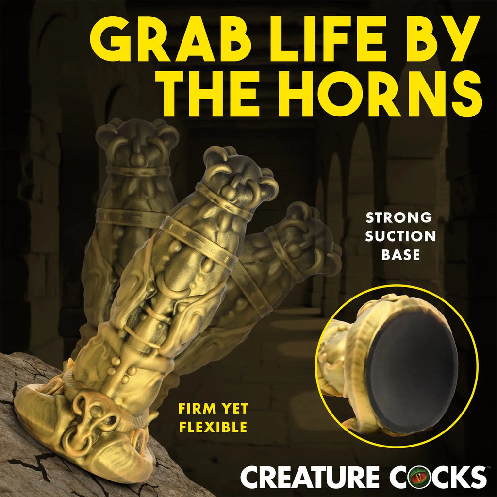 Gold-colored Creature Cocks King Minotaur silicone dildo with ornate detailing and a black suction base.