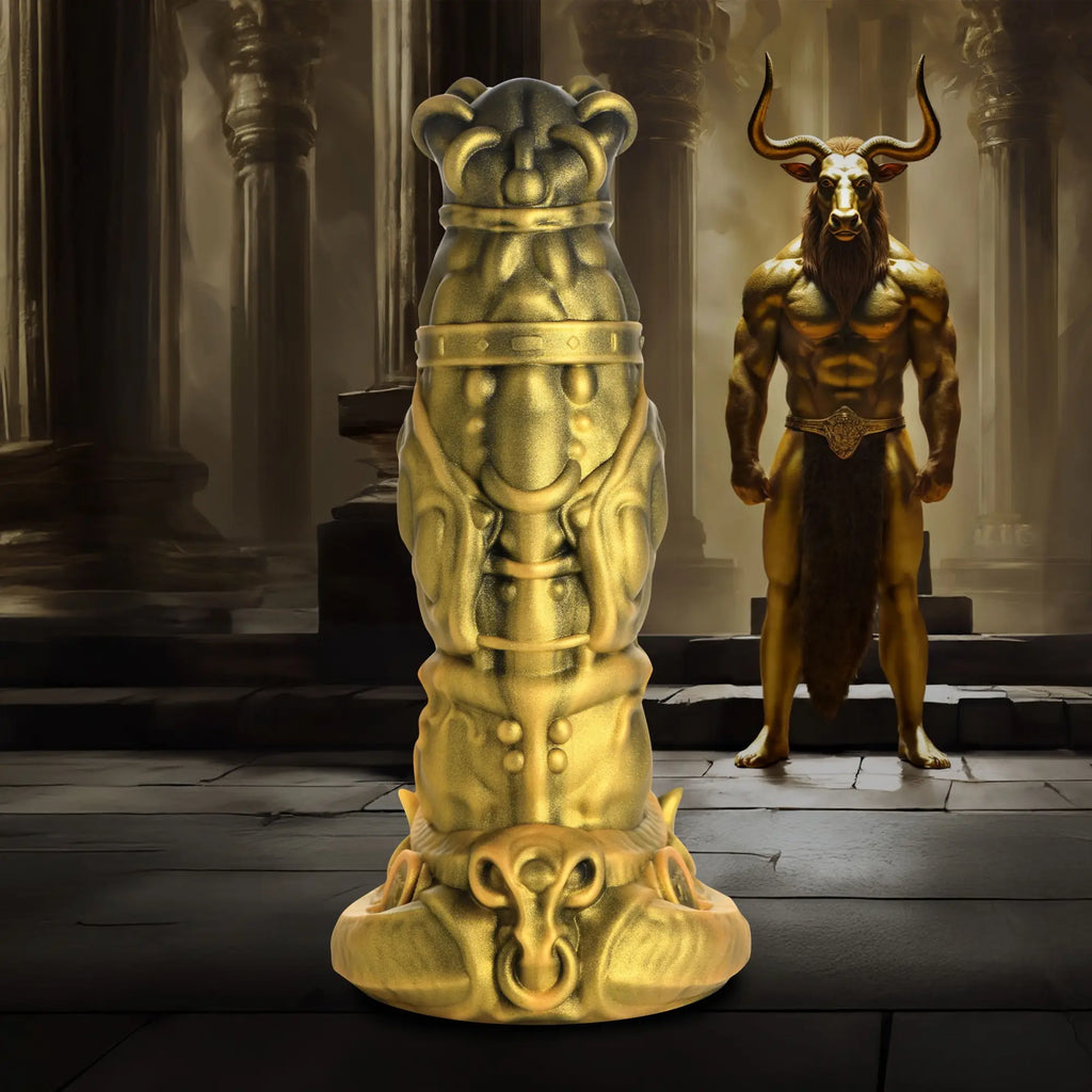 Creature Cocks King Minotaur silicone dildo: A metallic gold, ornate phallic toy with a bull-horned figure in the back.