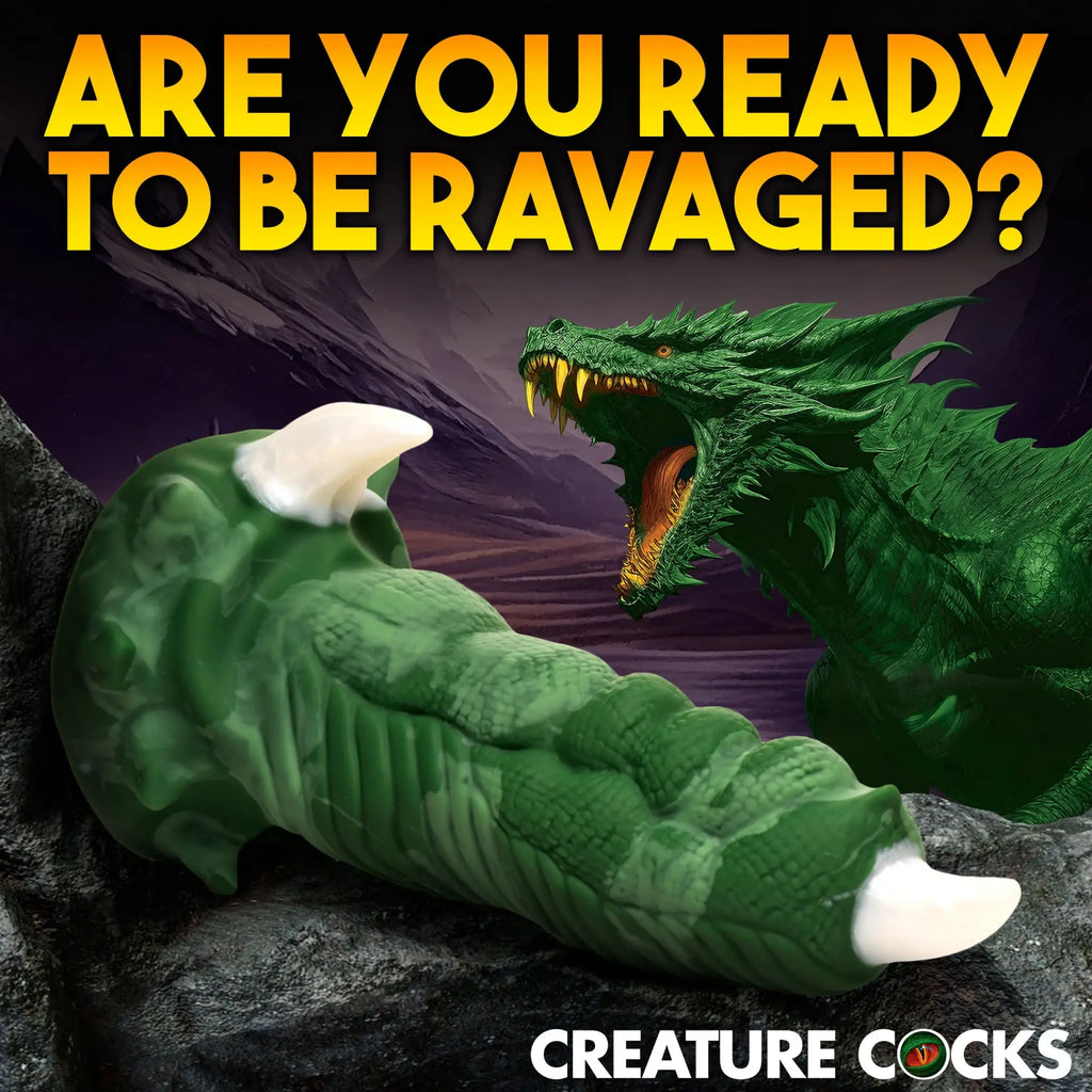 Creature Cocks Large Dragon Claw silicone dildo: a green, textured dragon-themed toy with white talons on a rocky base.