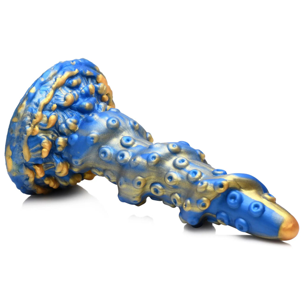 Creature Cocks Lord Kraken silicone dildo with a tentacle design in metallic blue and gold on a white background.