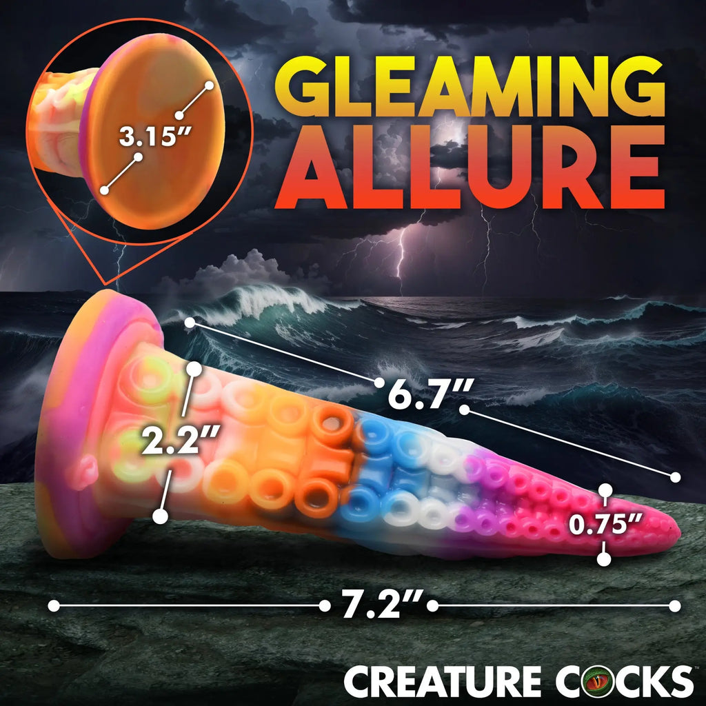 Creature Cocks Luminoctopus tentacle dildo with rainbow swirl colors and detailed suction cups on a stormy sea background.