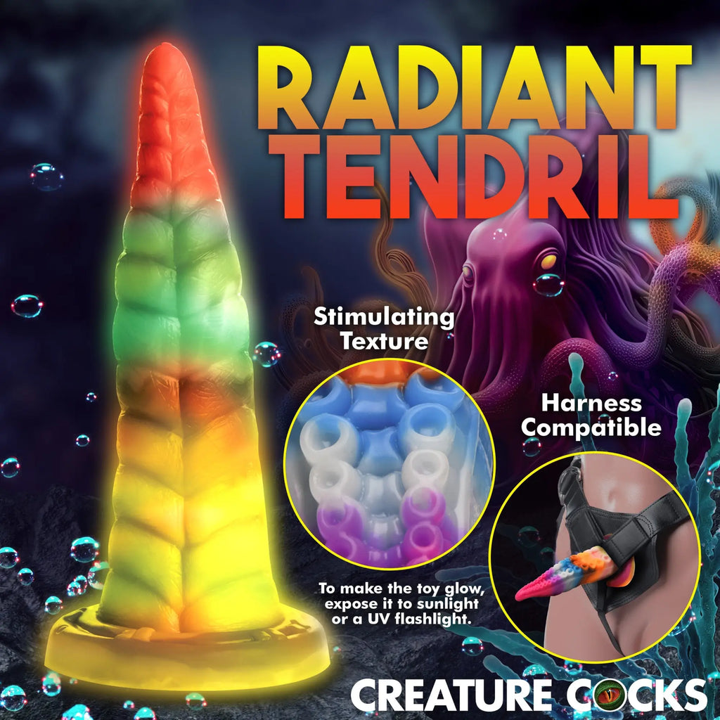 Creature Cocks Luminoctopus tentacle silicone dildo, a glowing, multicolored, textured product in an underwater setting.