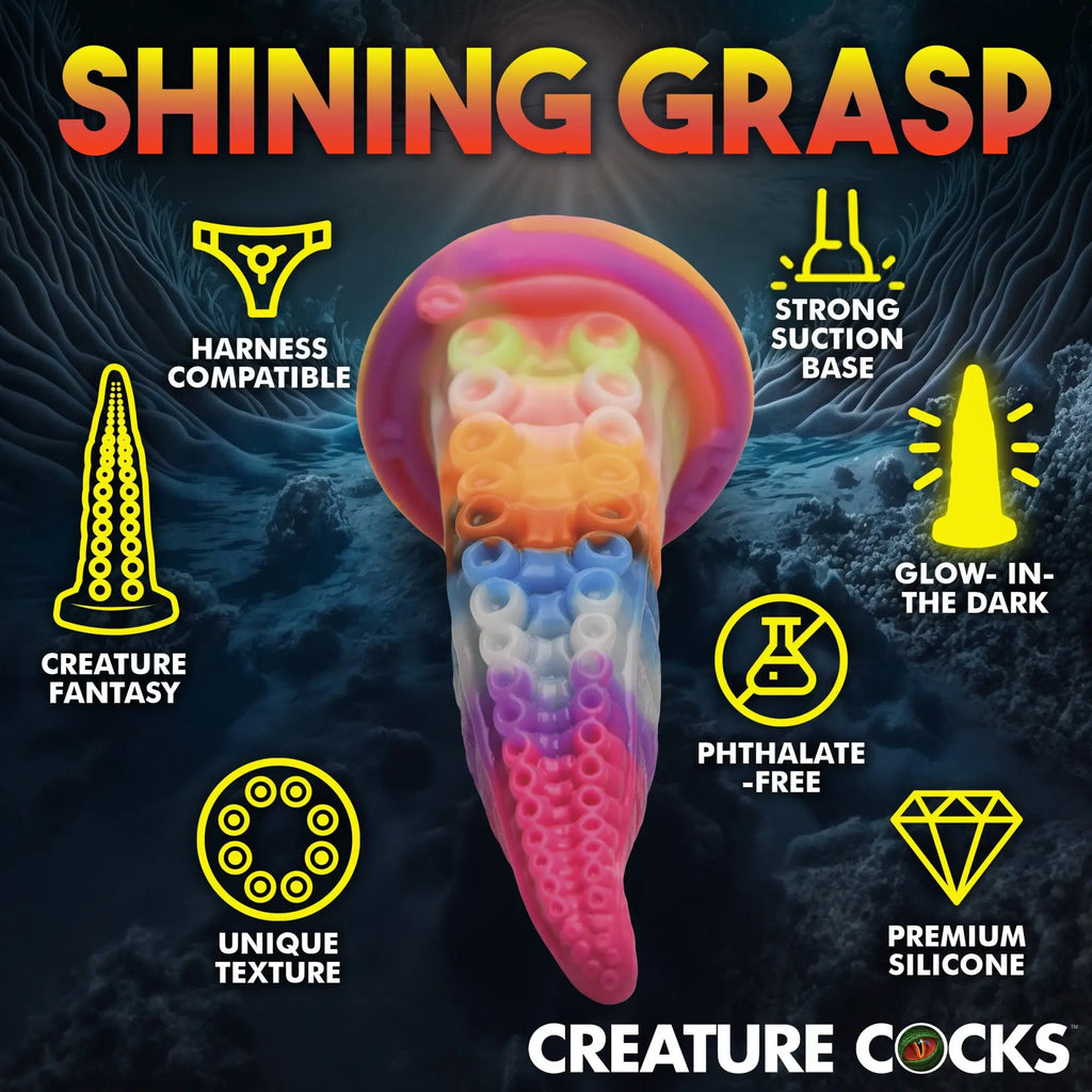 Creature Cocks Luminoctopus tentacle dildo in vibrant rainbow silicone with suction base, surrounded by feature icons.