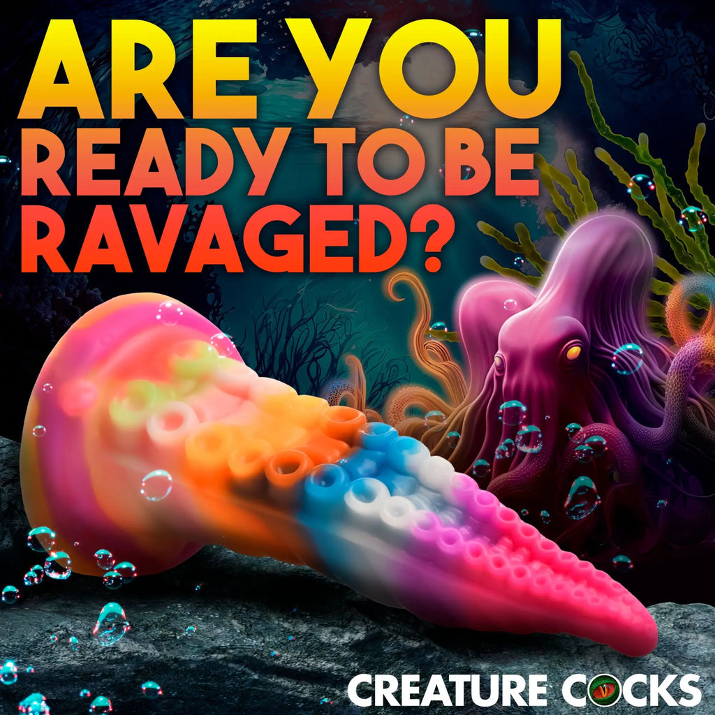 Creature Cocks Luminoctopus: A colorful, glow-in-the-dark, tentacle-shaped silicone dildo with suction cup details.