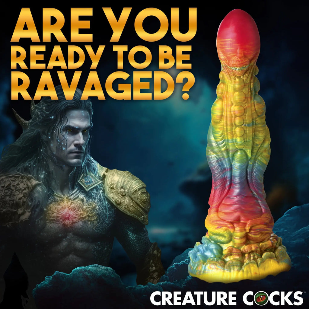 Creature Cocks Majestic Merman dildo: A textured, rainbow-swirled silicone toy shown beside a merman-themed character.