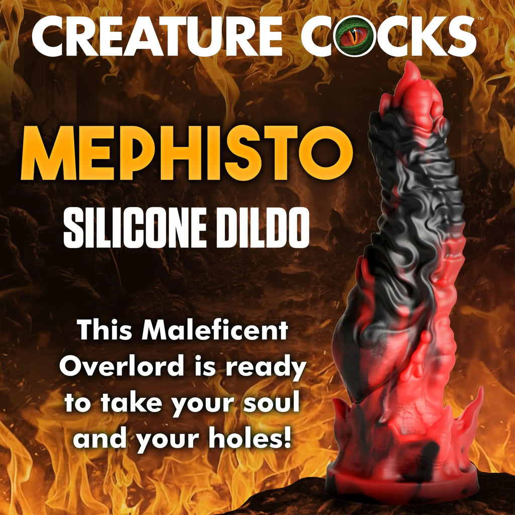 Creature Cocks Mephisto silicone dildo in a red and black marbled, textured fantasy design against a fiery background.