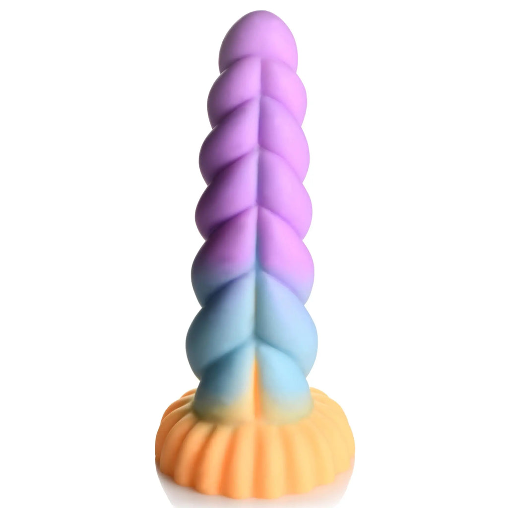 Creature Cocks Mystique silicone dildo in a spiral unicorn horn shape with a pastel purple-to-peach gradient.