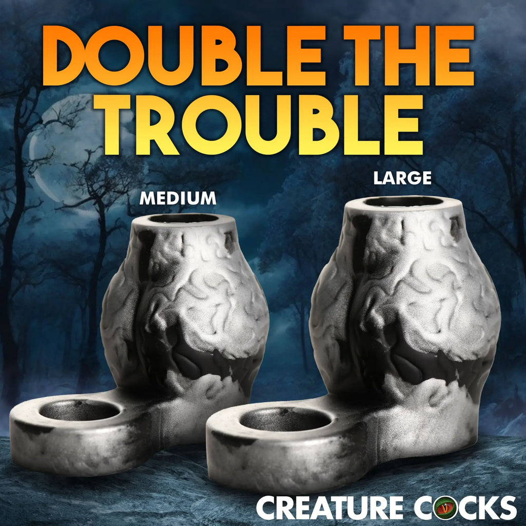 Creature Cocks Night Prowler silicone girth enhancers in Medium and Large, featuring a textured silver and black design.