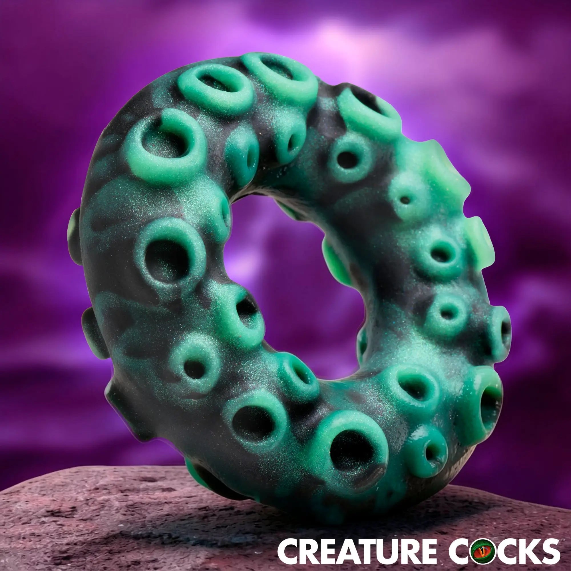 Creature Cocks Octo-Grip silicone cock ring in black and green with textured octopus suction cup details.