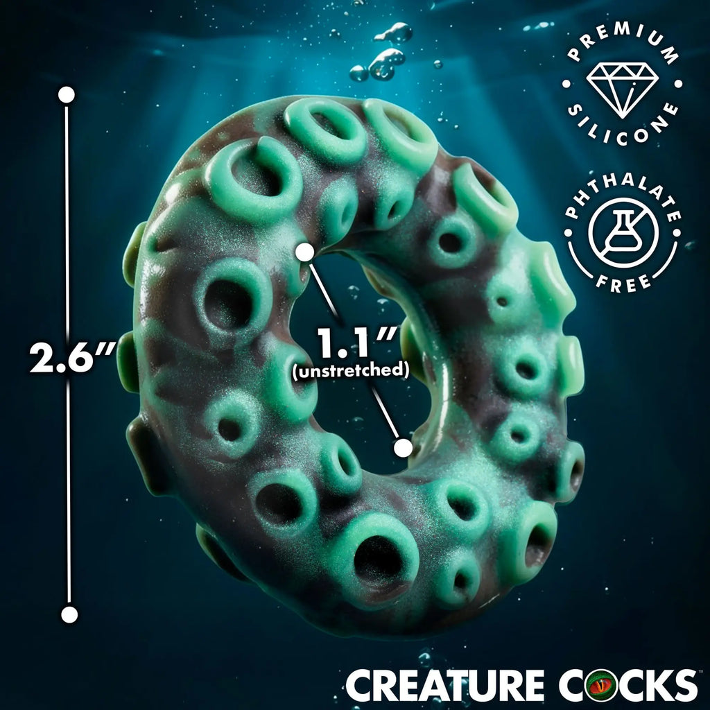 Creature Cocks Octo-Grip silicone cock ring in green and black with a textured, octopus-tentacle design and dimensions.