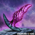Creature Cocks Octo-Twist silicone anal plug with textured purple and teal tentacle design, set against a star background.