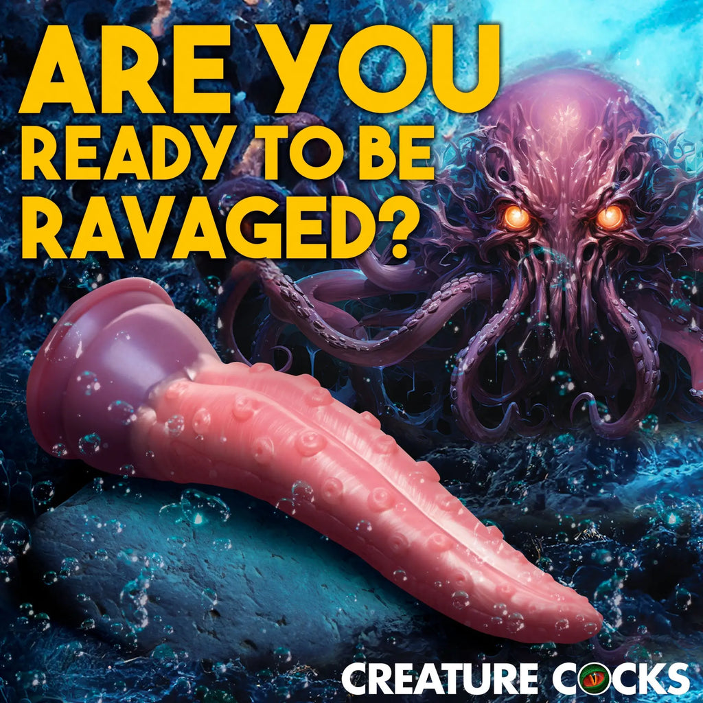 Creature Cocks Octoprobe: A pink, tentacle-shaped silicone dildo set against an underwater octopus monster background.