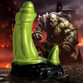 Creature Cocks lime green silicone Orc dildo with a black base, set against a fantasy battle background.