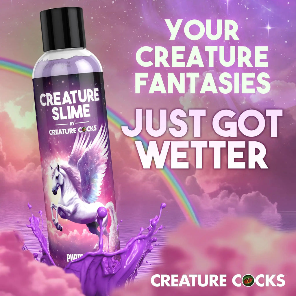 Creature Cocks Purple Creature Slime lubricant bottle featuring a pegasus against a whimsical, rainbow-filled purple sky.