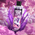 Creature Cocks Purple Creature Slime lubricant bottle featuring a winged horse against a purple cloud and splash backdrop.