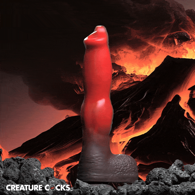 Creature Cocks Ramming Hound dildo in red and black silicone against a fiery volcano background.