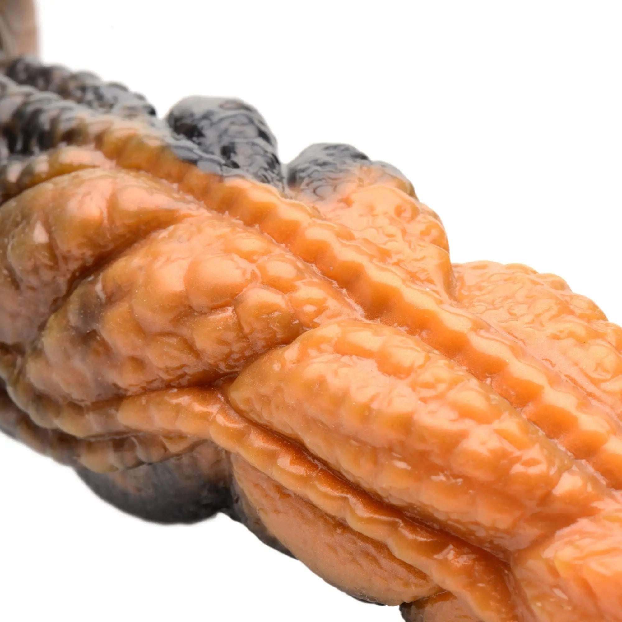 Creature Cocks Ravager silicone dildo with a rippled, tentacle-like design in gradient orange and dark brown.
