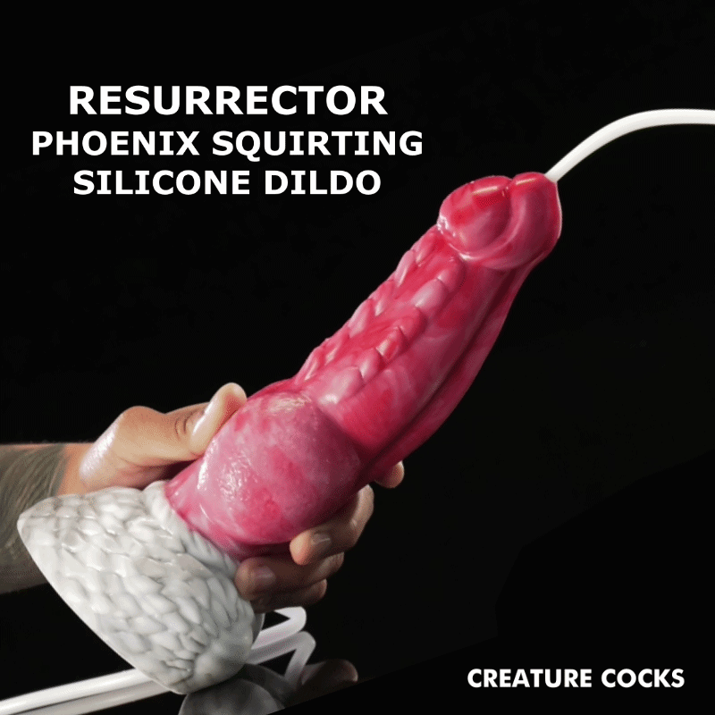 A hand holds a textured, pink Creature Cocks Resurrector Phoenix squirting dildo with a white base against a black backdrop.