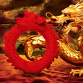 Creature Cocks Rise of the Dragon red silicone cock ring shaped like a coiled dragon, against a golden dragon background.