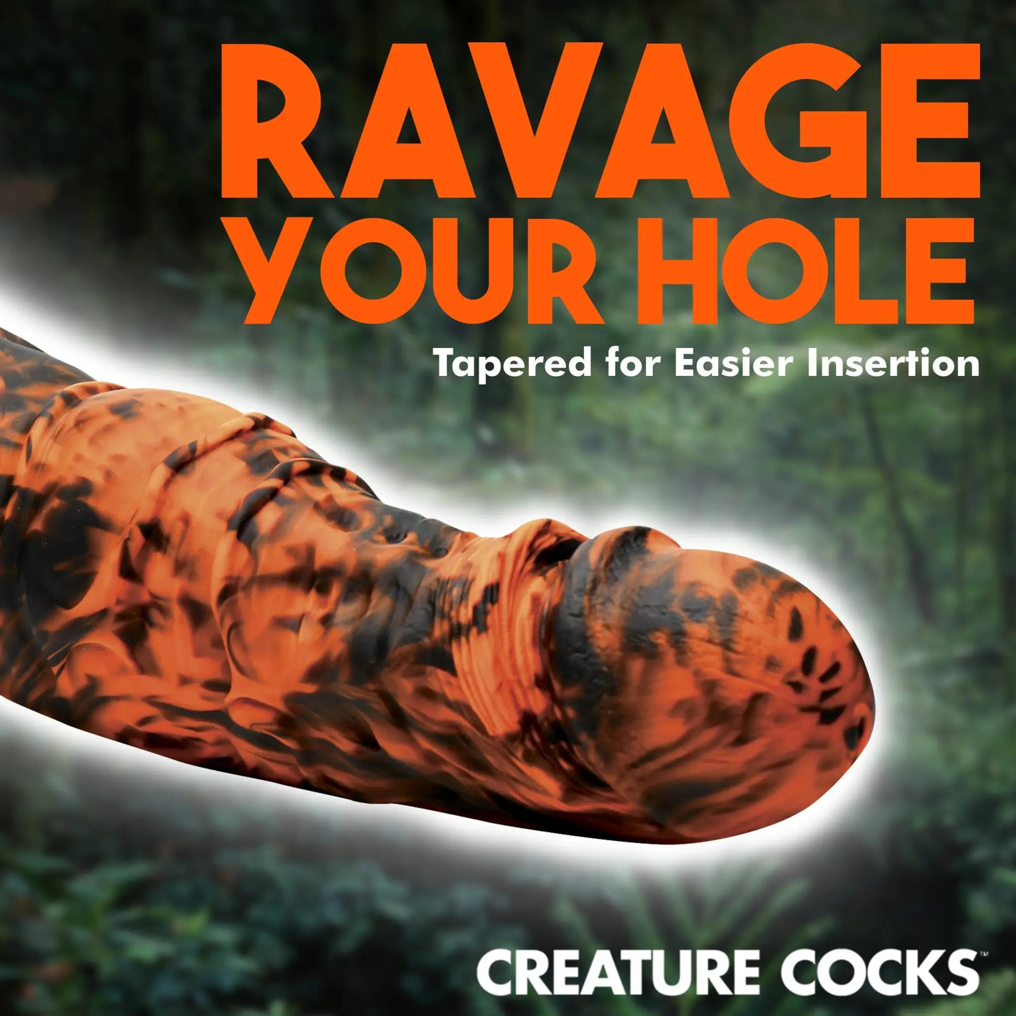 Creature Cocks Sabretooth silicone dildo in a textured, marbled orange and black tiger-stripe pattern.