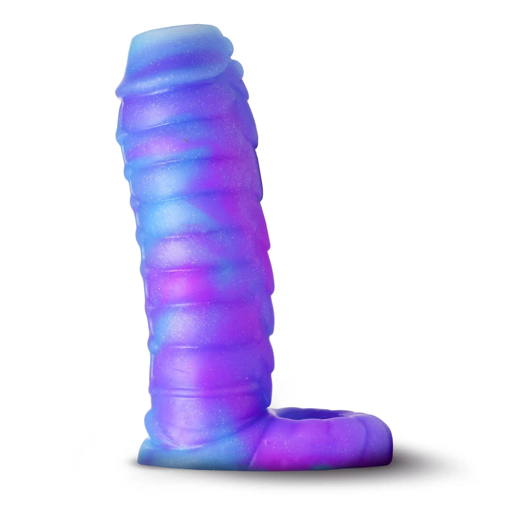 Creature Cocks Sea Stallion silicone enhancer in swirled, glittery purple and blue with a textured, ribbed design.