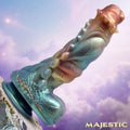 Creature Cocks Seraphina silicone dildo in iridescent teal and copper, featuring a textured dragon-style fantasy design.