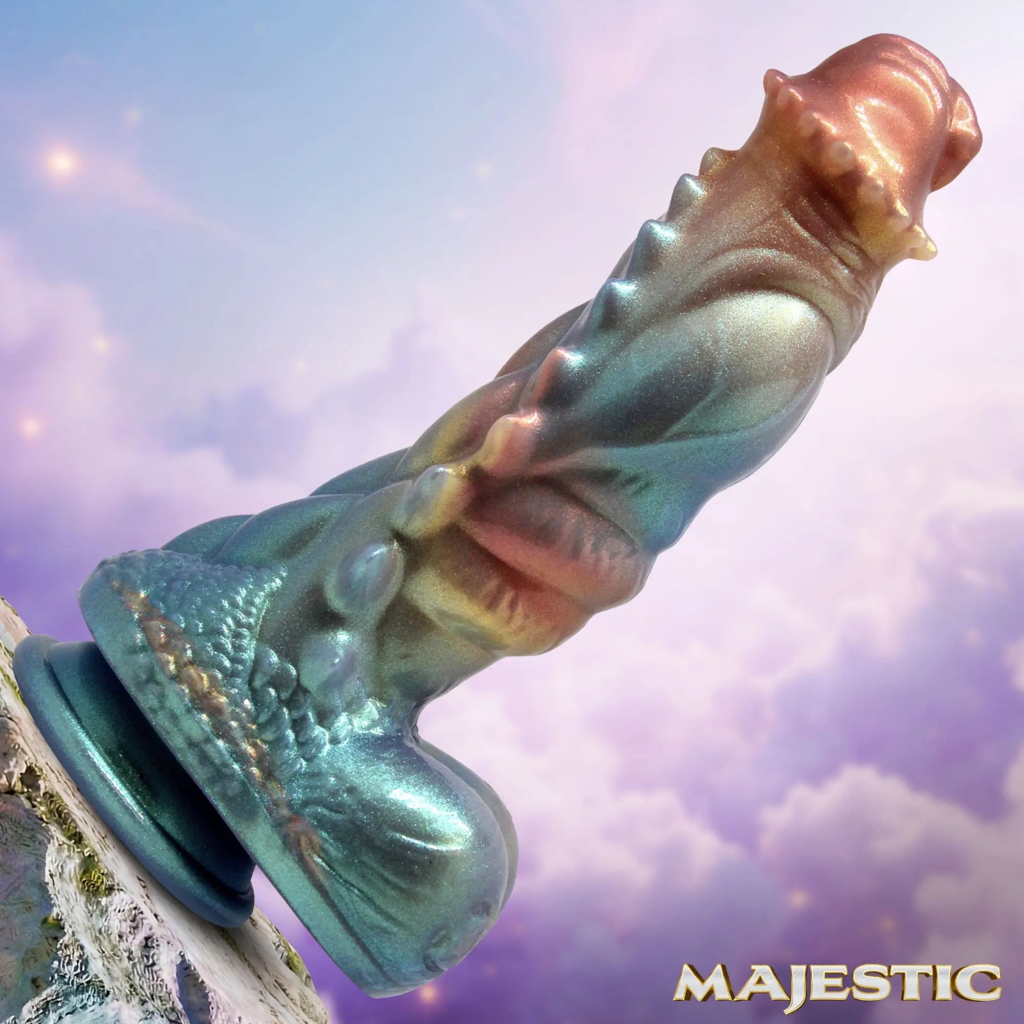 Creature Cocks Seraphina silicone dildo in iridescent teal and copper, featuring a textured dragon-style fantasy design.