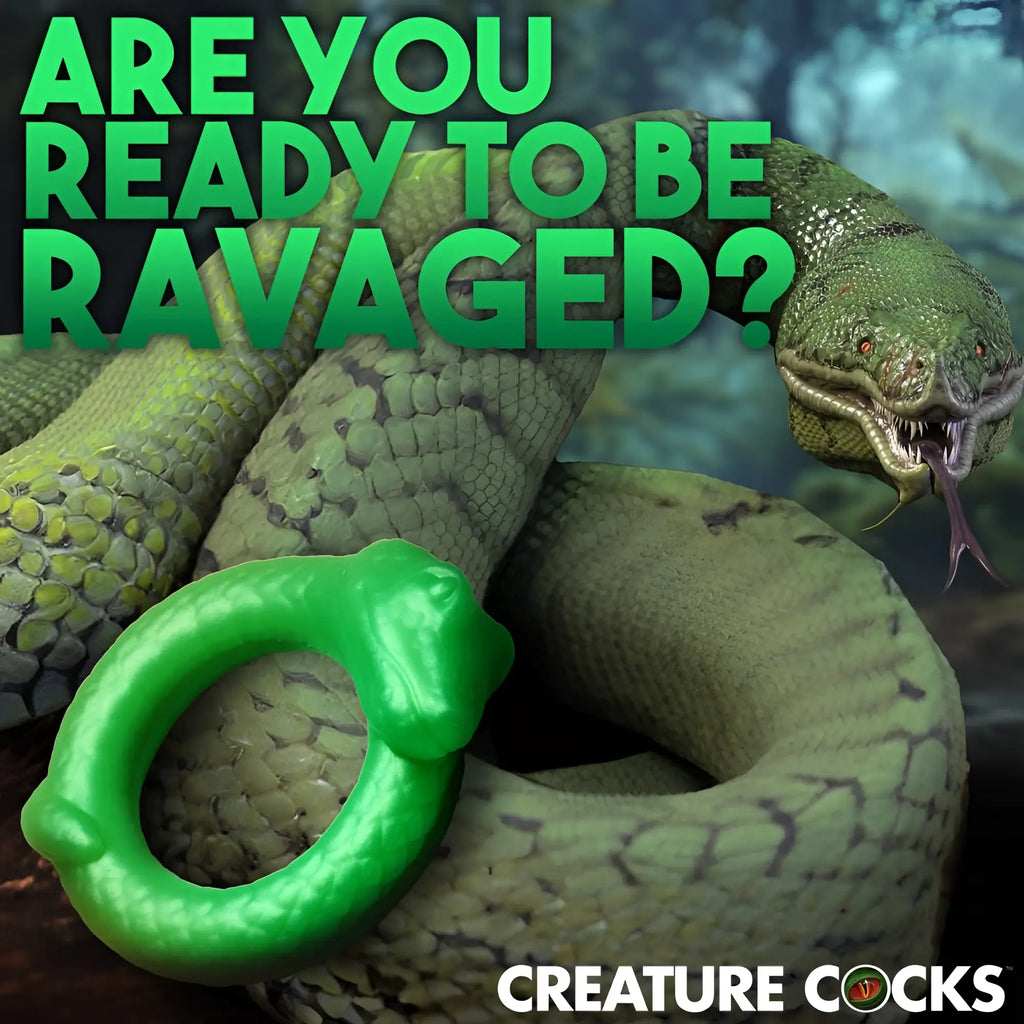 Creature Cocks Serpentine silicone cock ring in bright green, shaped like a snake, set against a large serpent background.