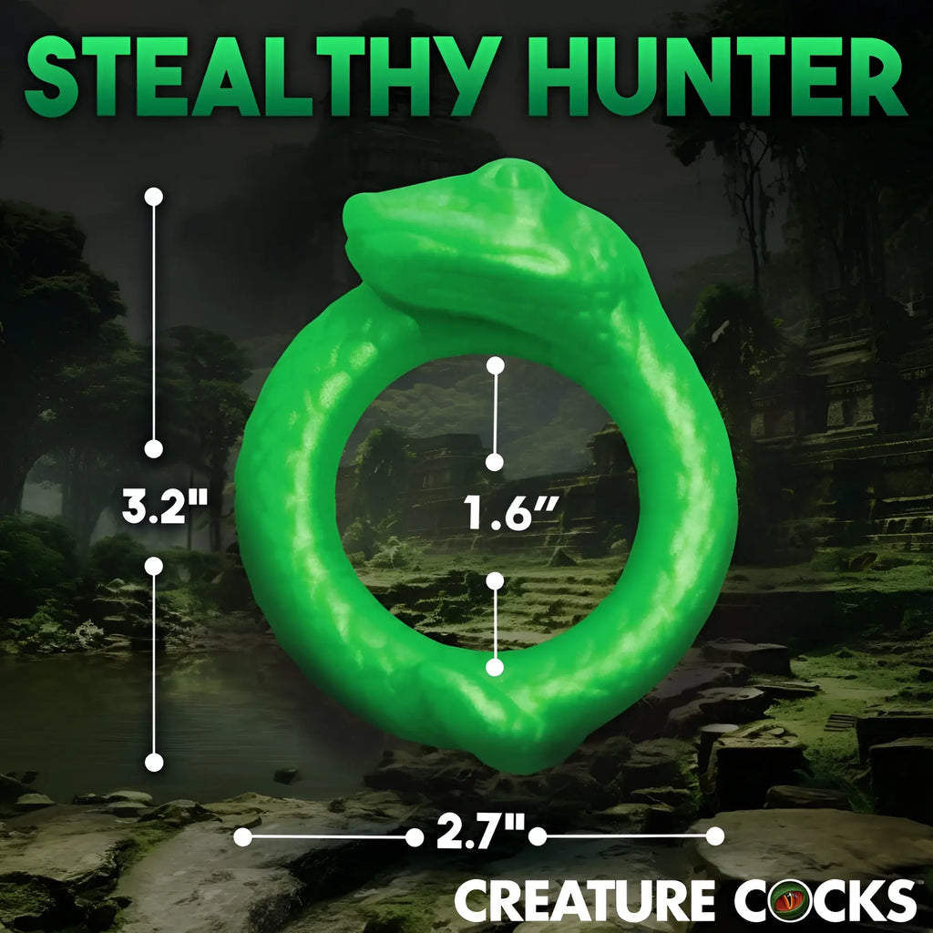 Bright green Creature Cocks Serpentine silicone cock ring shaped like a snake, showing dimensions against a jungle backdrop.