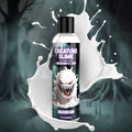 Creature Cocks Creature Slime lubricant bottle featuring a grinning white monster graphic against a white liquid splash.