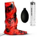 Creature Cocks red and black silicone squirt enhancer set with a black bulb pump and a measuring syringe.