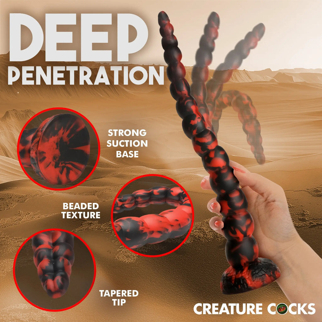 Creature Cocks The Stinger silicone dildo features a long, flexible beaded design in a black and red marbled color.