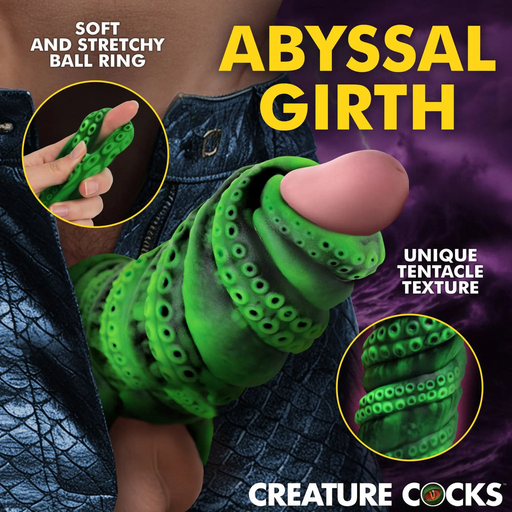 Creature Cocks Tenta Girth green, silicone, tentacle-textured penis enhancer with a flexible ring in a stormy setting.