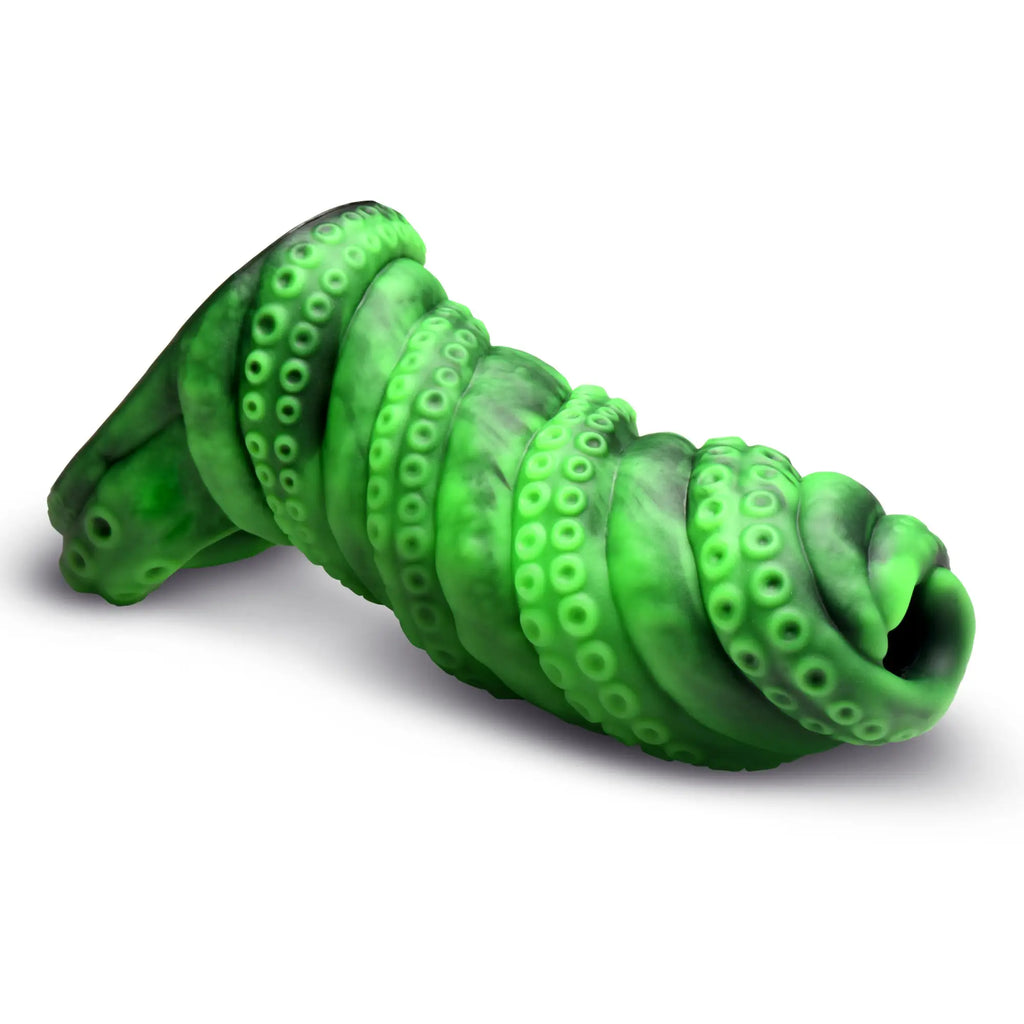 Creature Cocks Tenta Girth penis enhancer in a marbled green silicone, shaped like a textured, coiled tentacle.