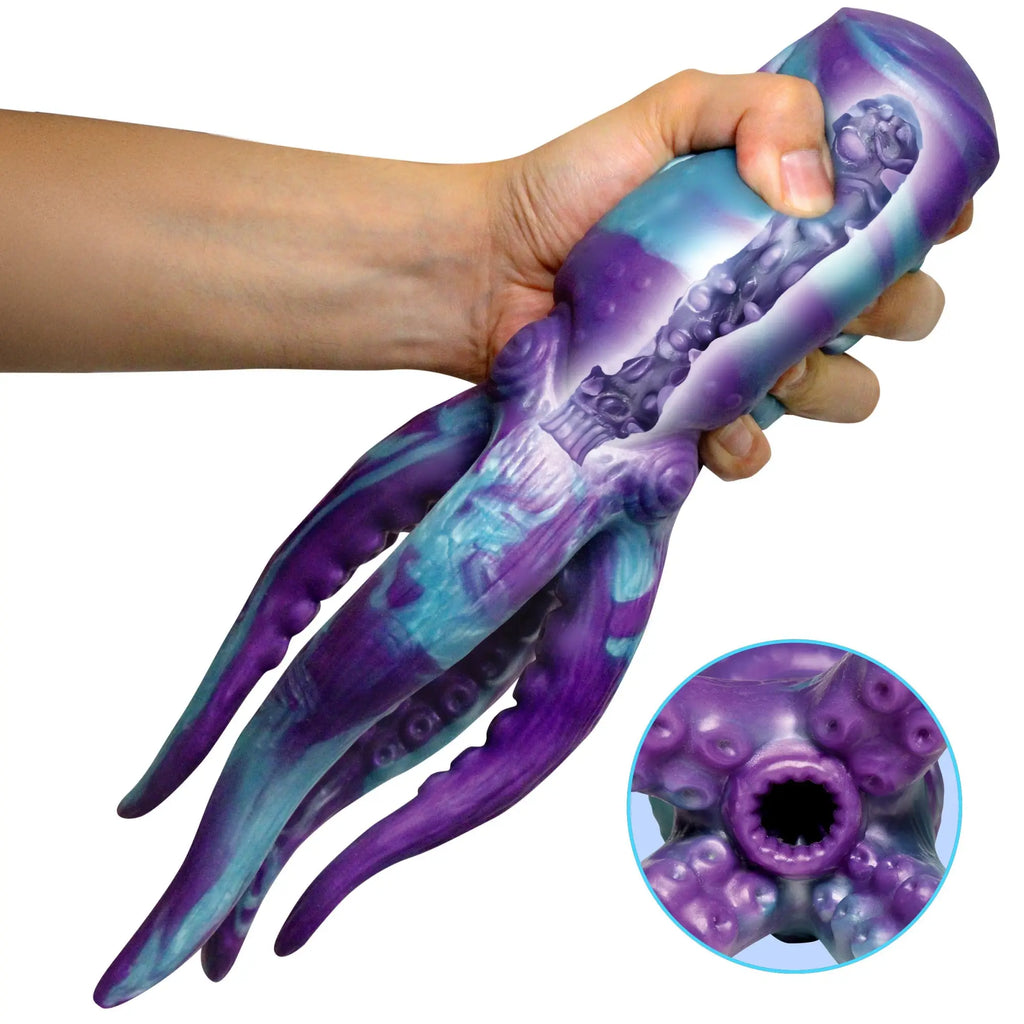 Creature Cocks Tenta Stroke masturbator: a purple and blue octopus-themed silicone sleeve held by a hand.