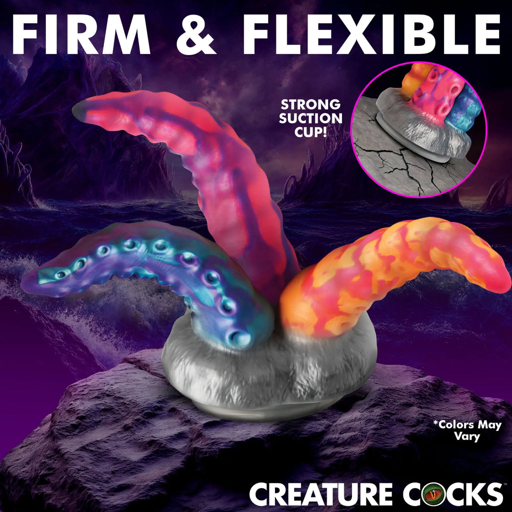 Creature Cocks Tenta-Trio silicone dildo with three multi-colored, textured tentacles rising from a suction cup base.